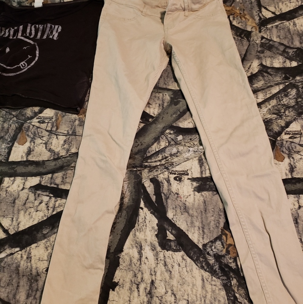 Hollister tan jeans and black shear shirt